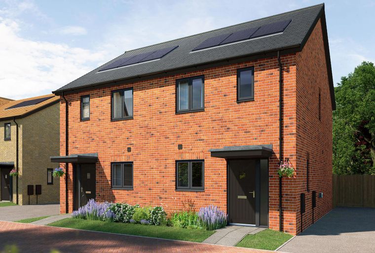 A pair of modern semi-detached brick houses with dark-framed windows and solar panels on the roof.