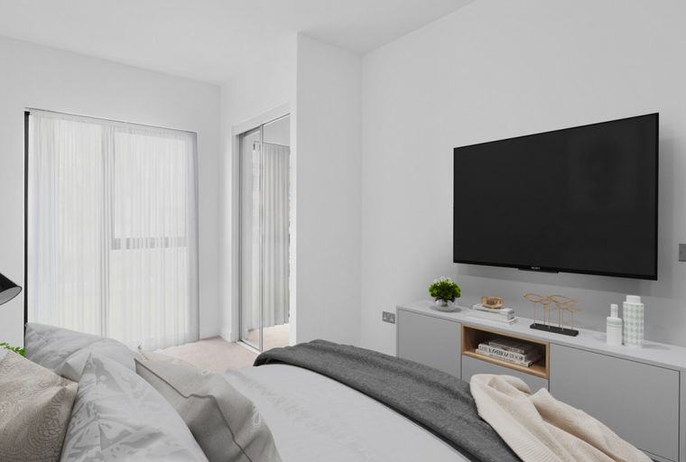 A bedroom with a bed, a television, and a media console.