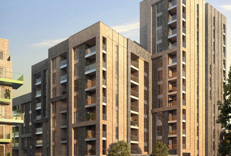A modern apartment building with brick facades and balconies.