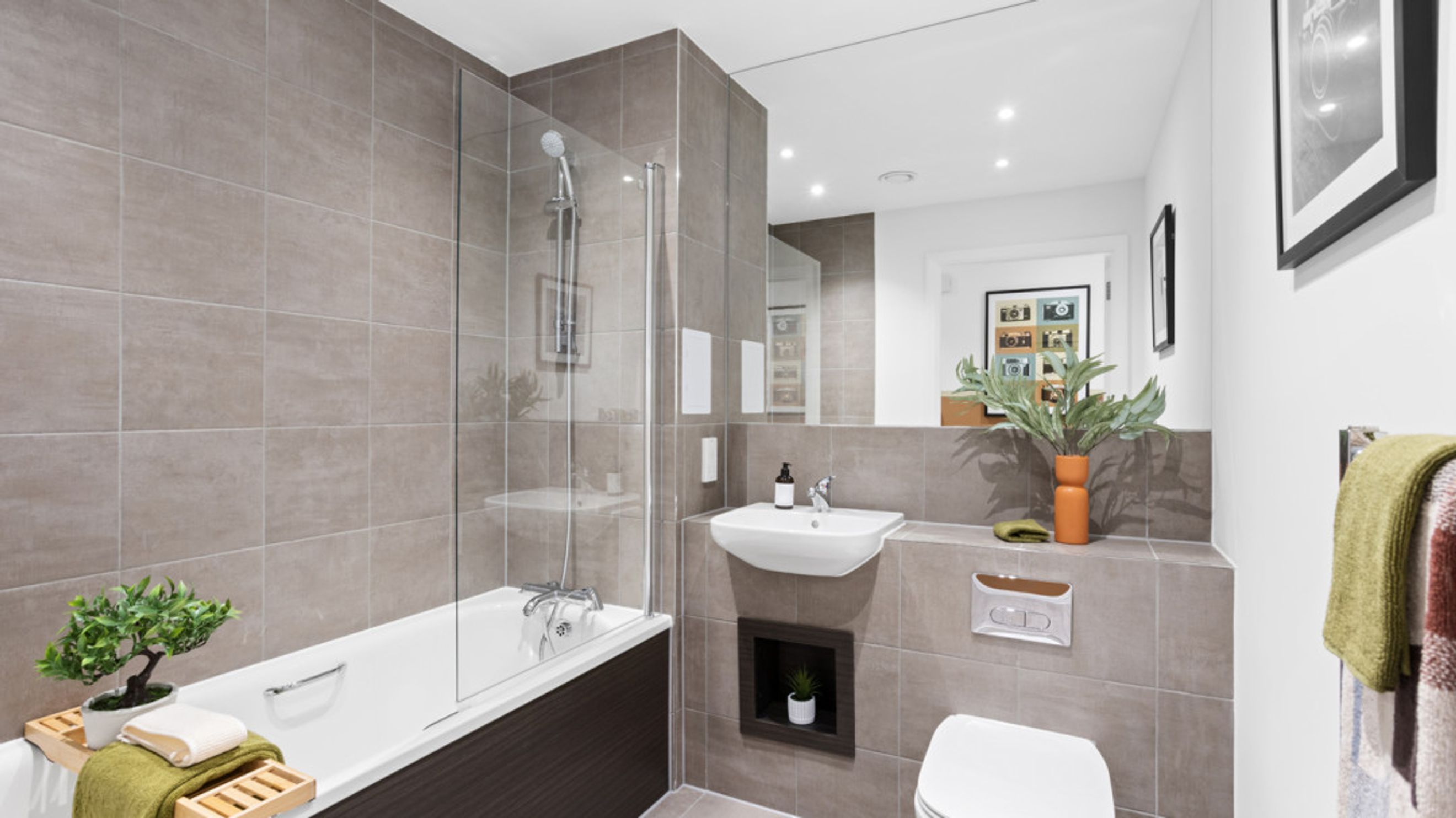 A bathroom with a bathtub, sink, and toilet.