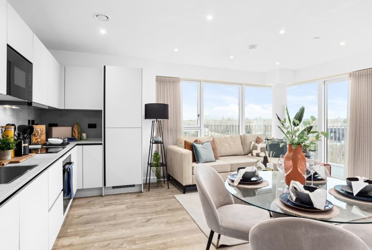 A modern apartment with a kitchen, living area, and dining space.