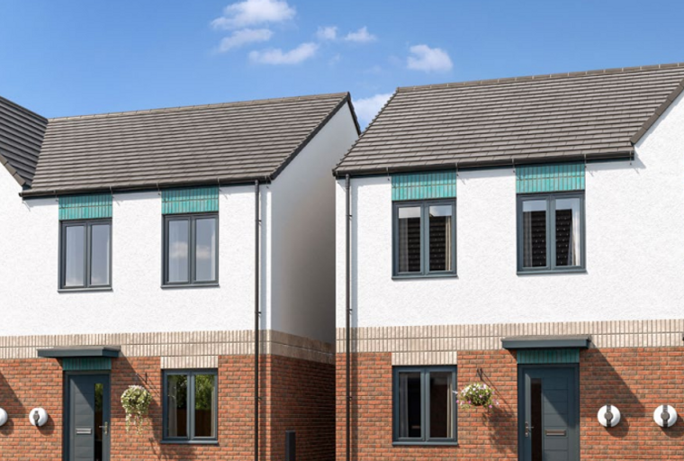A row of modern townhouses with white stucco exteriors, brick lower levels, and gray windows.