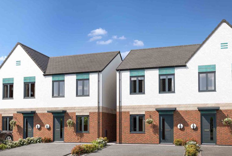 A row of modern townhouses with white render and brick facades under a tiled roof.