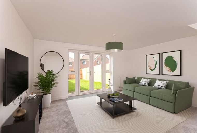 A living room with a green sofa, coffee table, and double doors leading to a backyard.