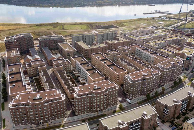 An aerial view of a modern residential complex with multiple buildings.