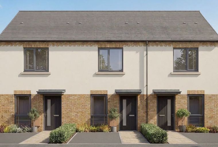 A row of modern townhouses with brick and stucco exteriors, featuring dark doors and windows, under a gray tiled roof.