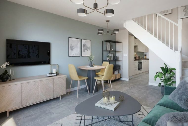 A living room with a TV, dining table, chairs, and a staircase.