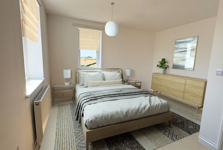 A bedroom with a bed, bedside tables, a dresser, and a window.