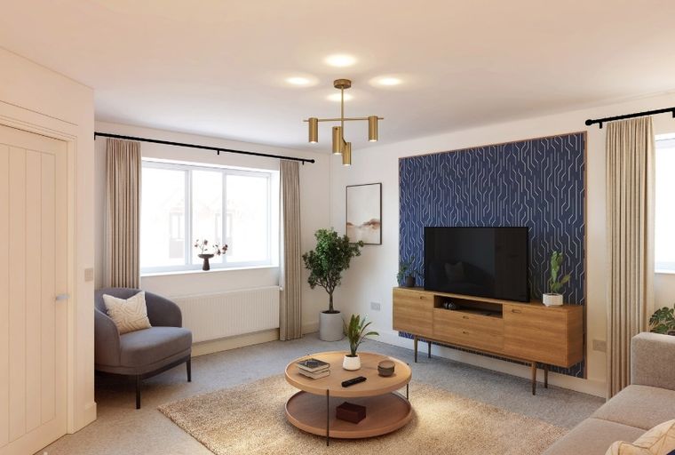 A living room with a sofa, armchair, coffee table, and television.