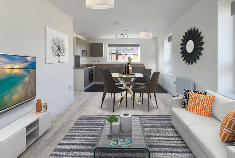 A living room and kitchen area with a sofa, coffee table, dining table, and kitchen cabinets.