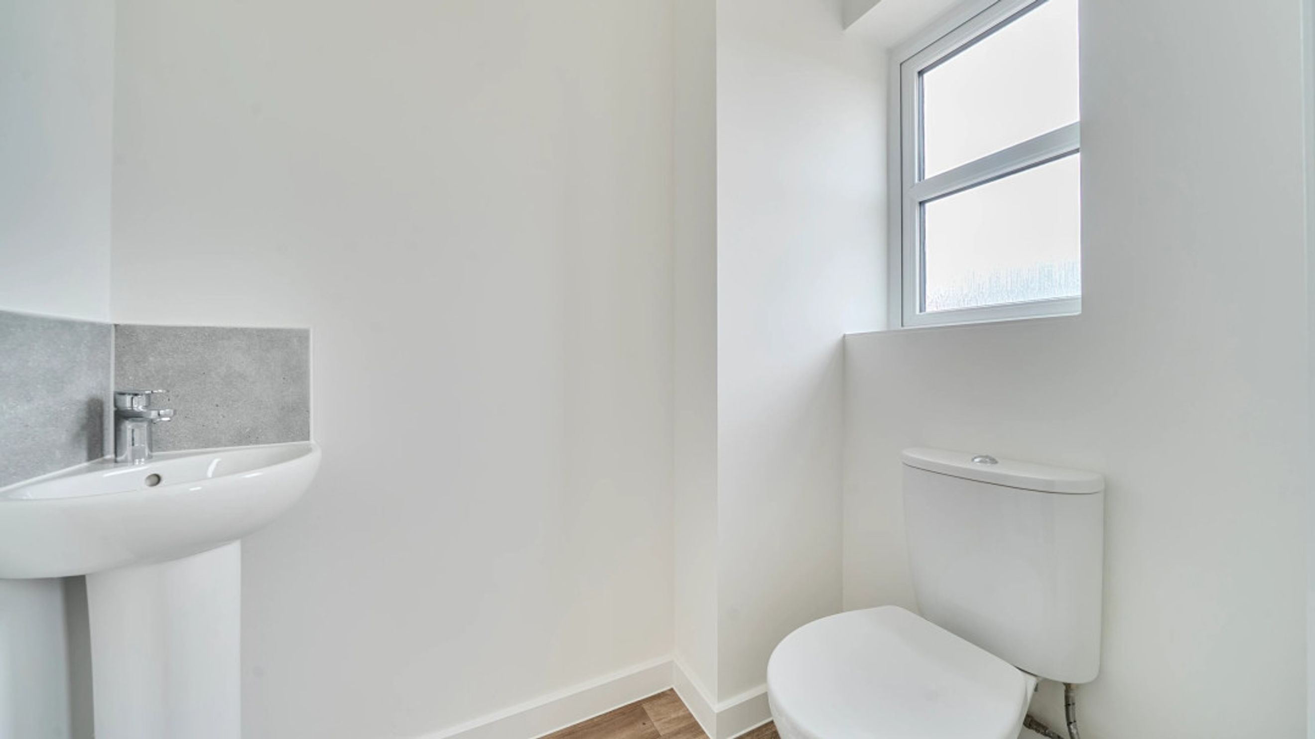 A bathroom with a sink and a toilet.