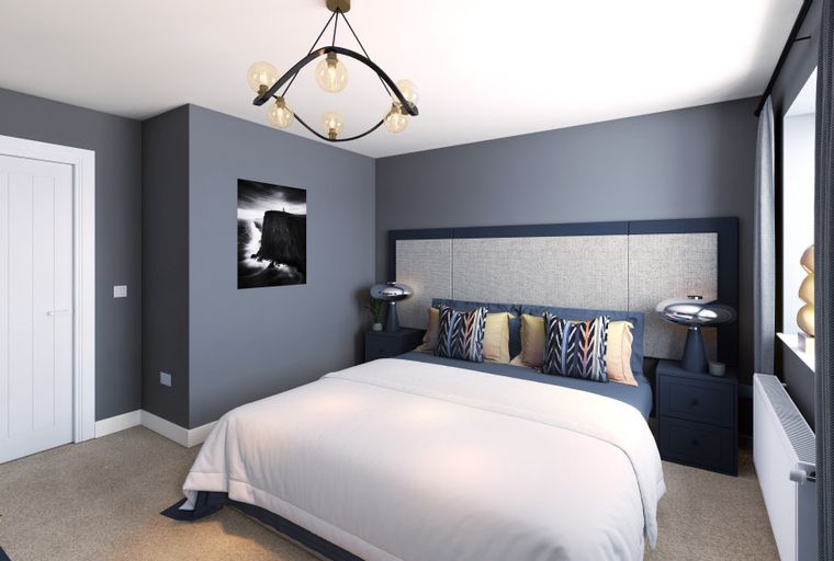 A bedroom with a bed, bedside tables, and a chandelier.