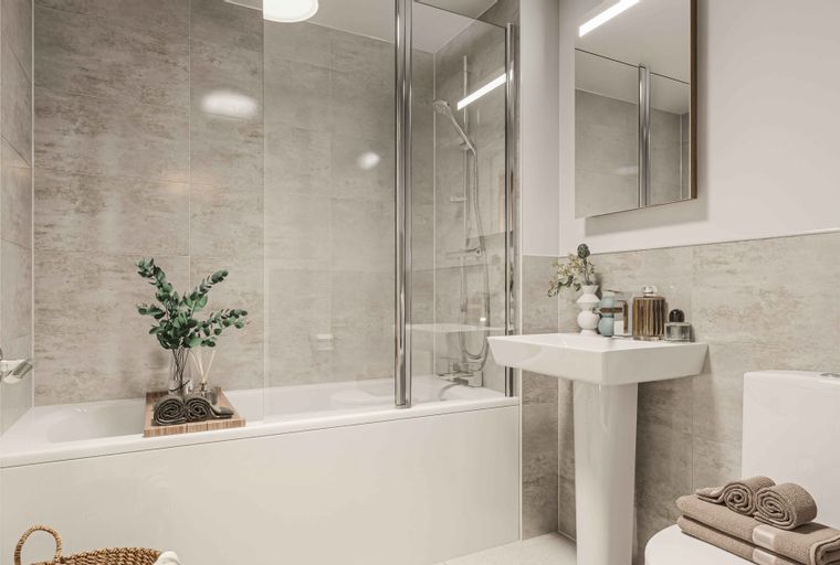 A bathroom with a bathtub, a sink, and a toilet.