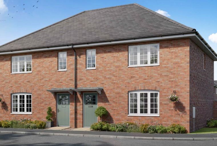A semi-detached brick house with green doors and white windows under a grey tiled roof.