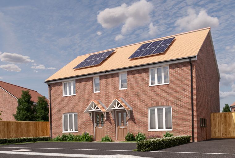 A pair of semi-detached brick houses with solar panels on the roof.