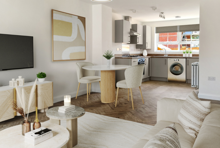 A living room and kitchen area with a sofa, dining table, and kitchen appliances.