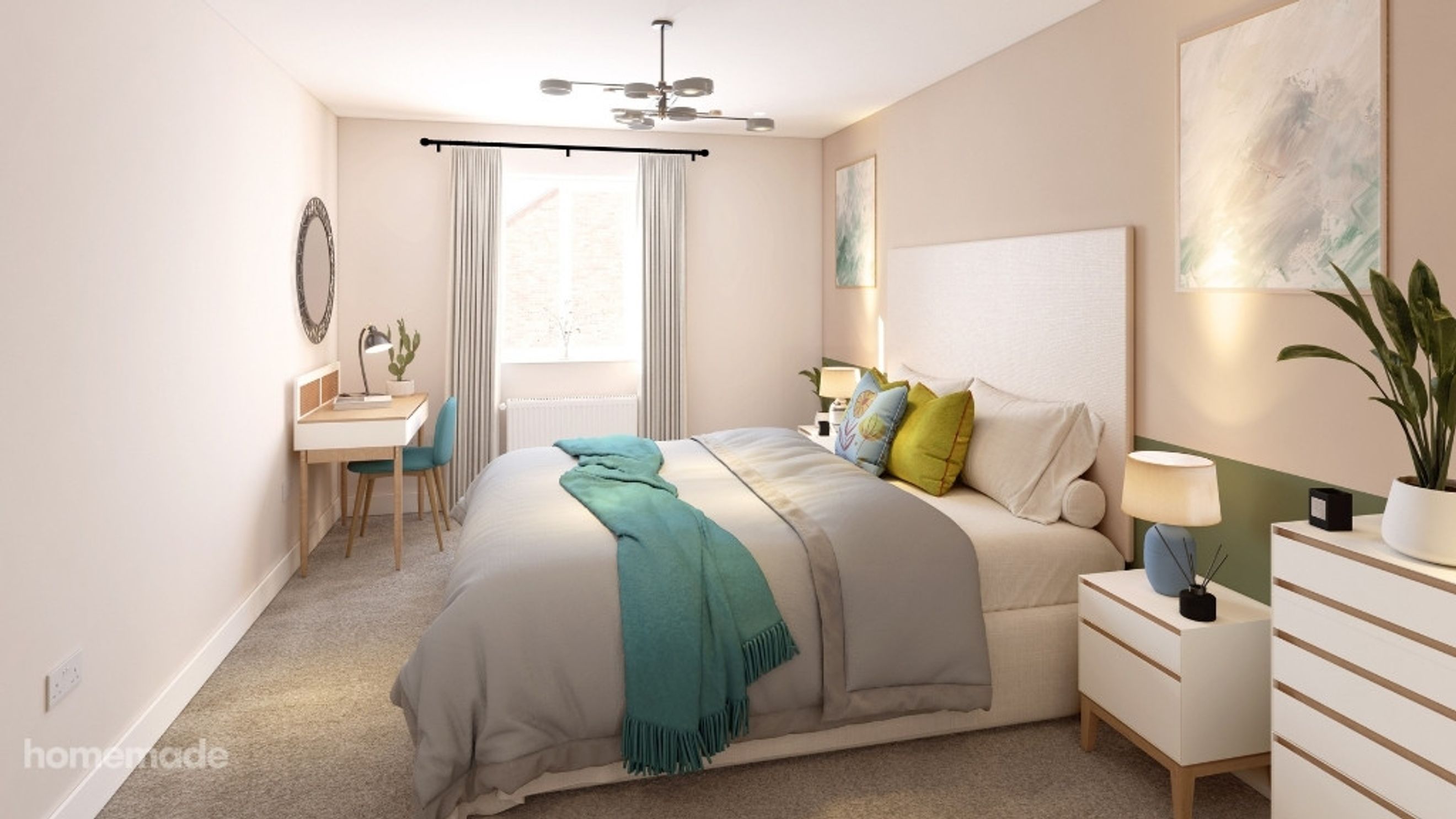 A bedroom with a bed, a desk, and a dresser.