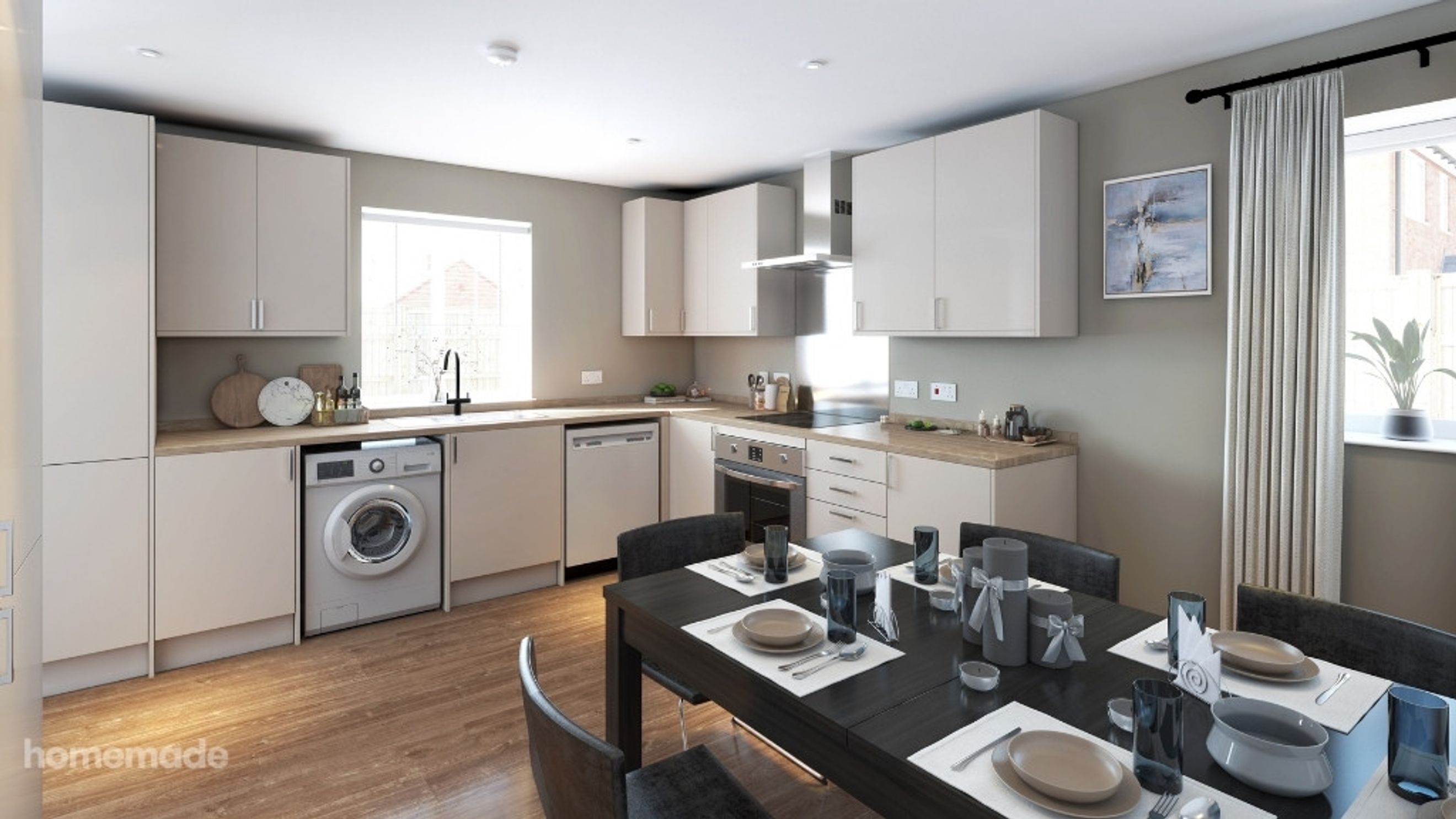 A kitchen and dining area with a washing machine, dishwasher, oven, and a dining table set for a meal.