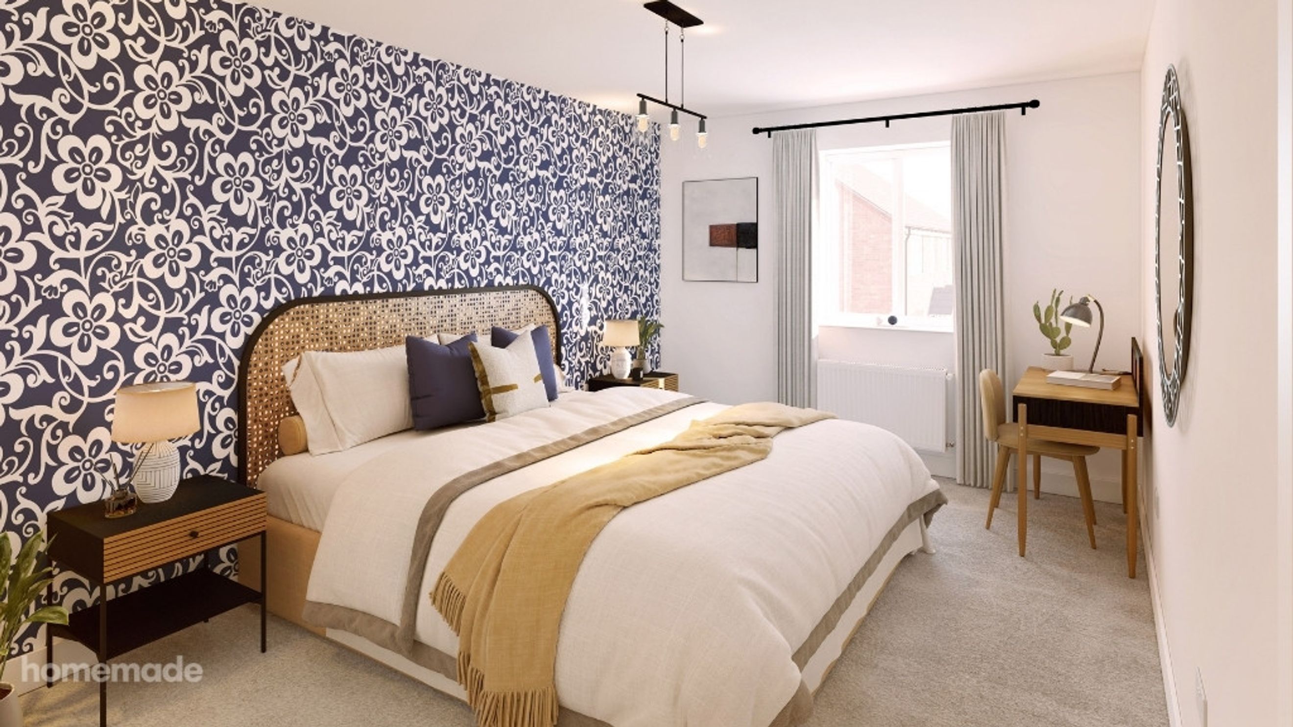 A bedroom with a bed, bedside table, and a desk.
