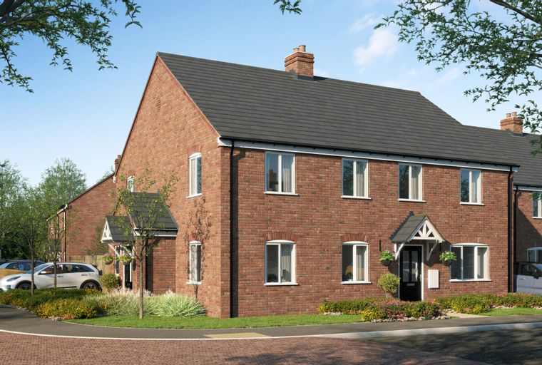 A row of red brick townhouses with dark grey roofs and white-framed windows, parked cars, and trees.