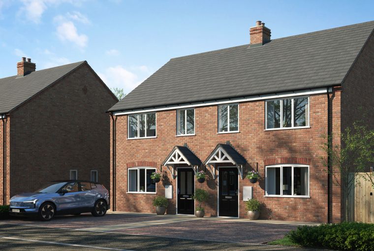 A row of red brick semi-detached houses with grey tiled roofs and modern front doors.
