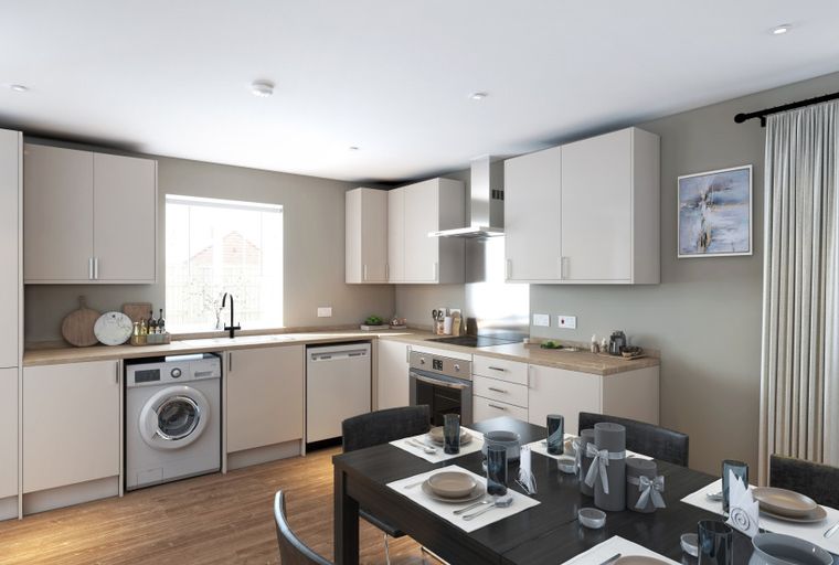 A kitchen and dining area with a washing machine, dishwasher, oven, and a dining table set for meals.
