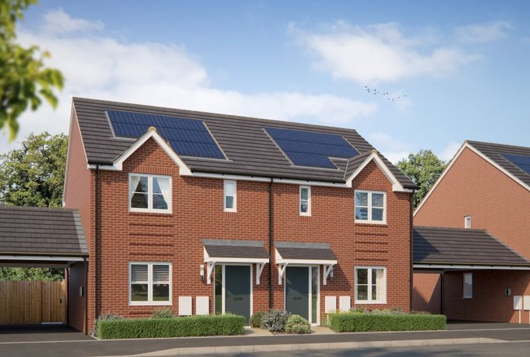 A row of red brick semi-detached houses with solar panels on the roof.