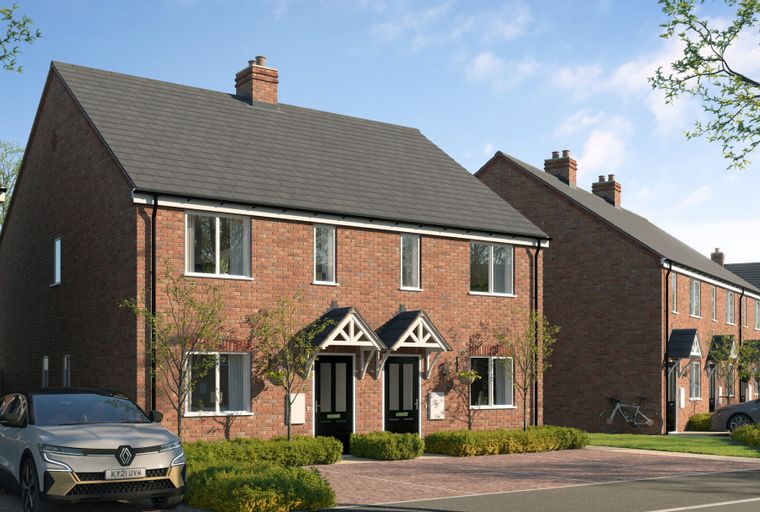 A row of modern brick houses with pitched roofs and front gardens.