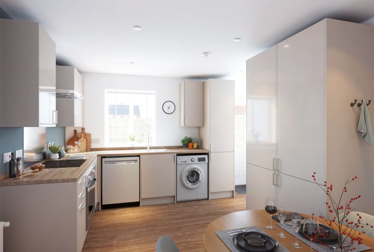 A modern kitchen with light-colored cabinets, a dishwasher, and a washing machine.