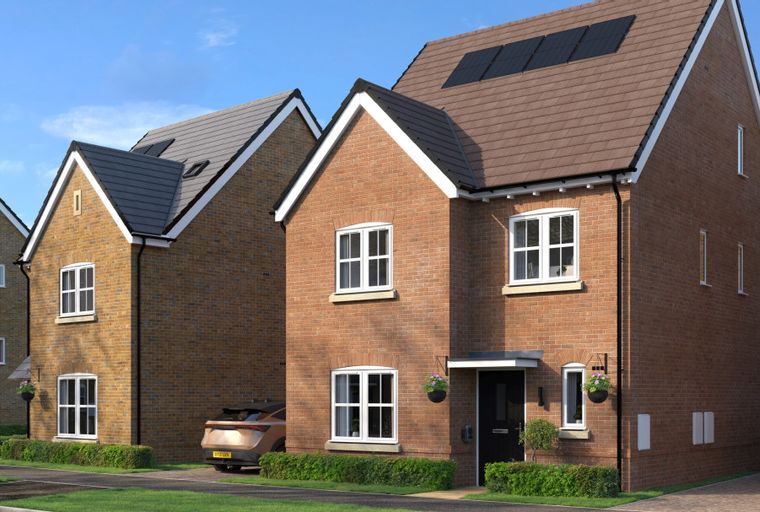 A row of modern brick houses with solar panels on the roof under a blue sky.