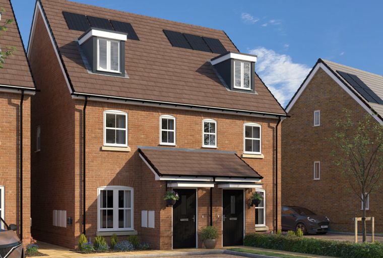 A row of modern brick houses with dormer windows and solar panels on the roof.