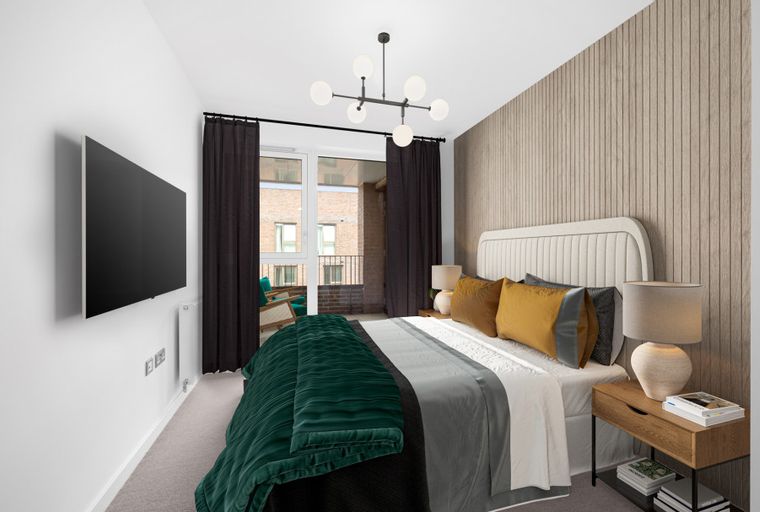 A bedroom with a bed, a TV, and a chandelier.