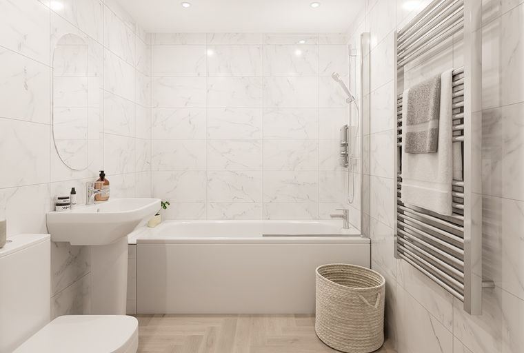 A bathroom with a bathtub, sink, toilet, and a heated towel rack.