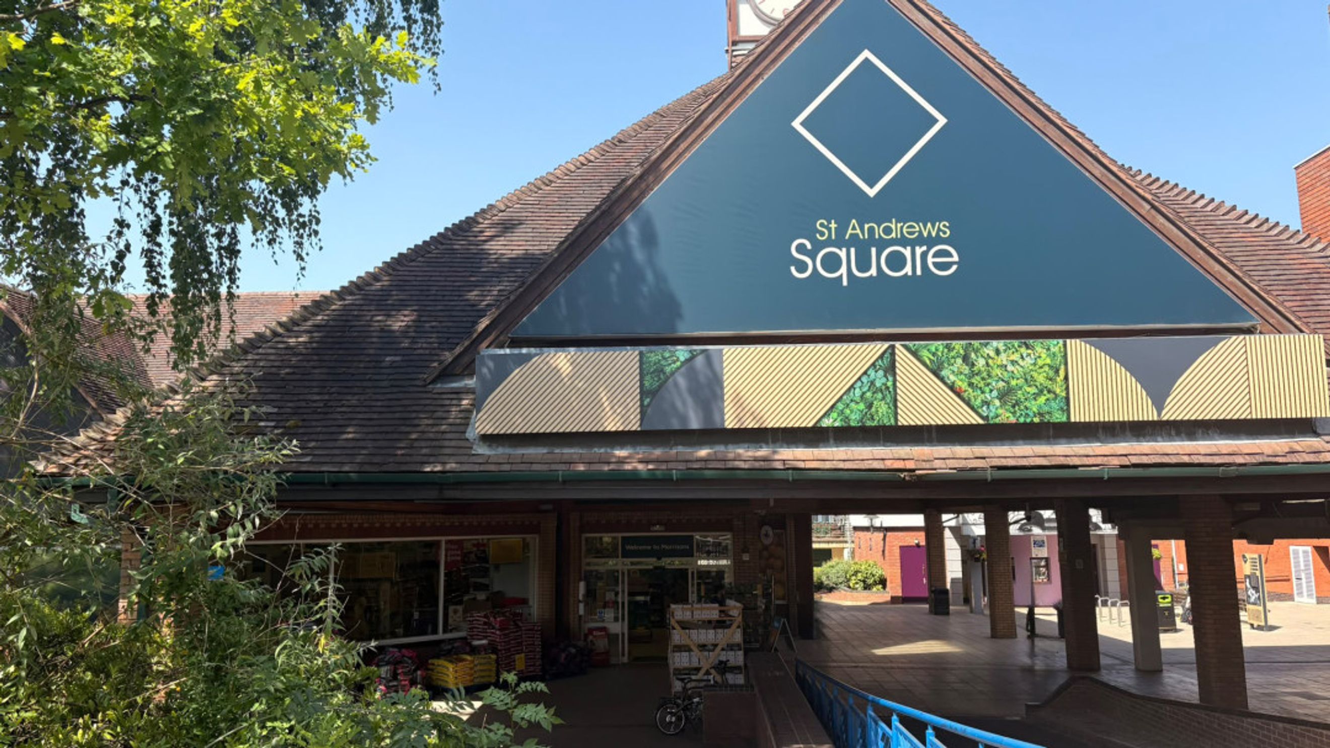 A shopping center entrance with a sign that says 'St Andrews Square'.