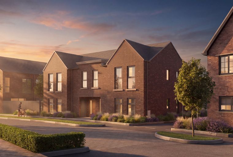 A street view of modern brick houses with manicured lawns and trees during sunset.