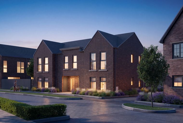A row of modern brick houses with illuminated windows at dusk.