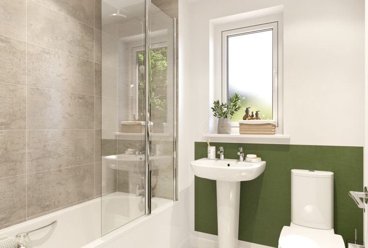 A bathroom with a bathtub, a sink, and a toilet.
