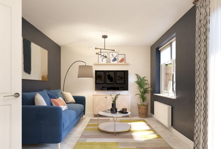 A living room with a blue sofa, television, coffee table, and a large window.