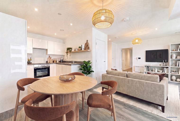 A dining area and living room with a sofa, television, and a dining table with chairs.