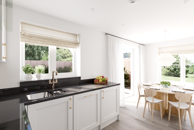 A kitchen and dining area with a sink, countertops, a table, and chairs.