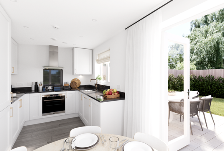 A modern kitchen with white cabinets, a granite countertop, and an oven, opening to an outdoor patio.