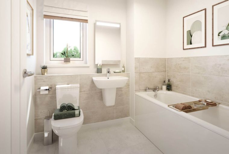 A bathroom with a toilet, sink, and bathtub.