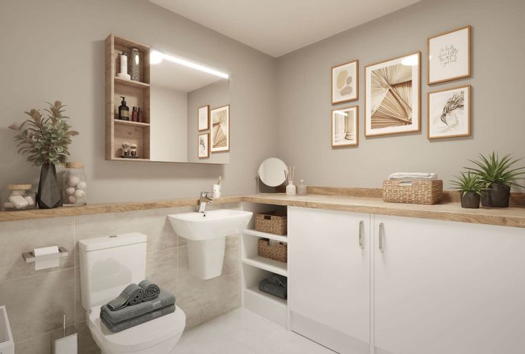 A bathroom with a toilet, sink, vanity, and artwork on the wall.