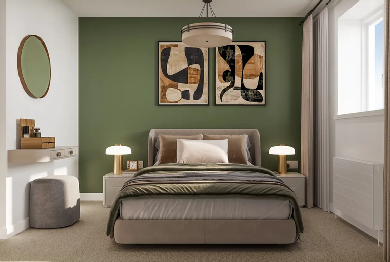 A bedroom with a bed, bedside tables, lamps, and abstract art on a green wall.