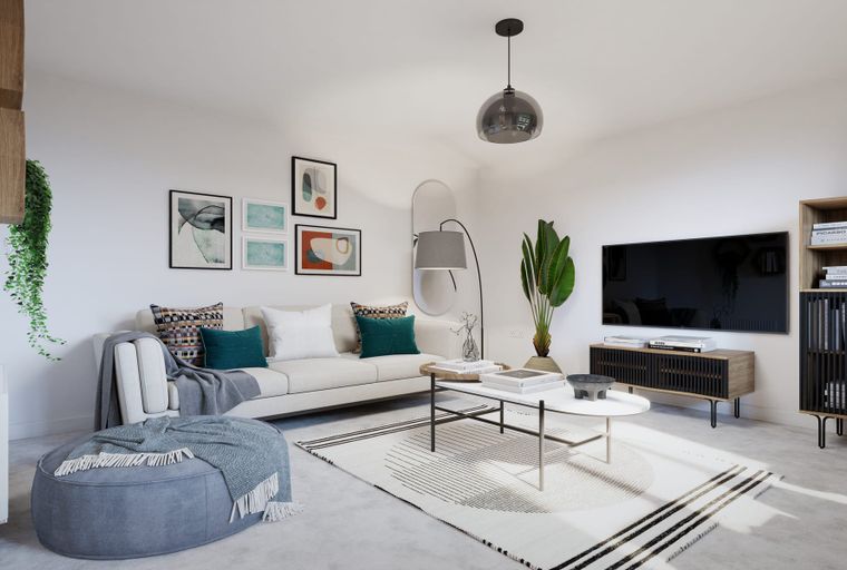 A living room with a sofa, coffee table, rug, and television.