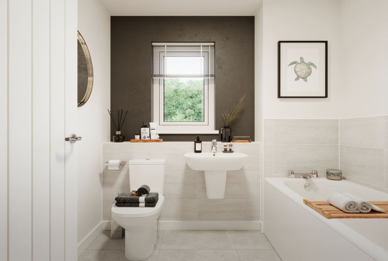 A bathroom with a toilet, sink, and bathtub.