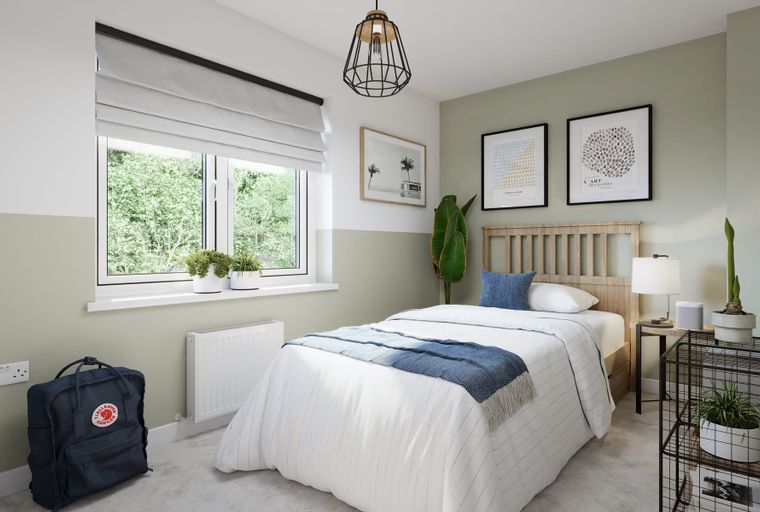 A bedroom with a bed, window, and a backpack.