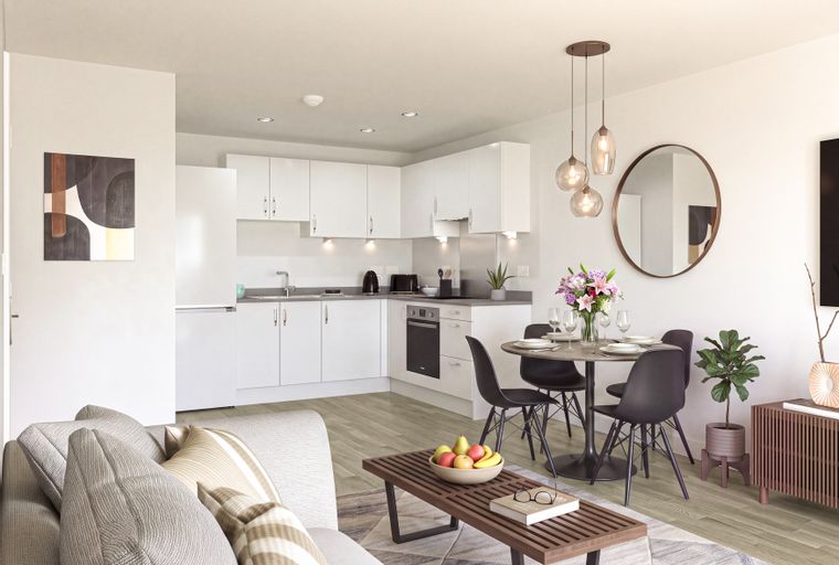 A modern living and dining area adjacent to a white kitchen.
