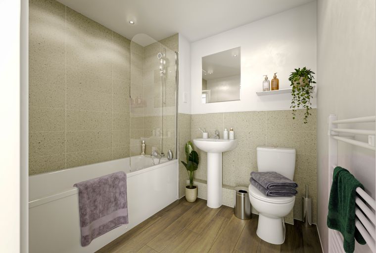 A bathroom with a bathtub, sink, toilet, and a towel rack.