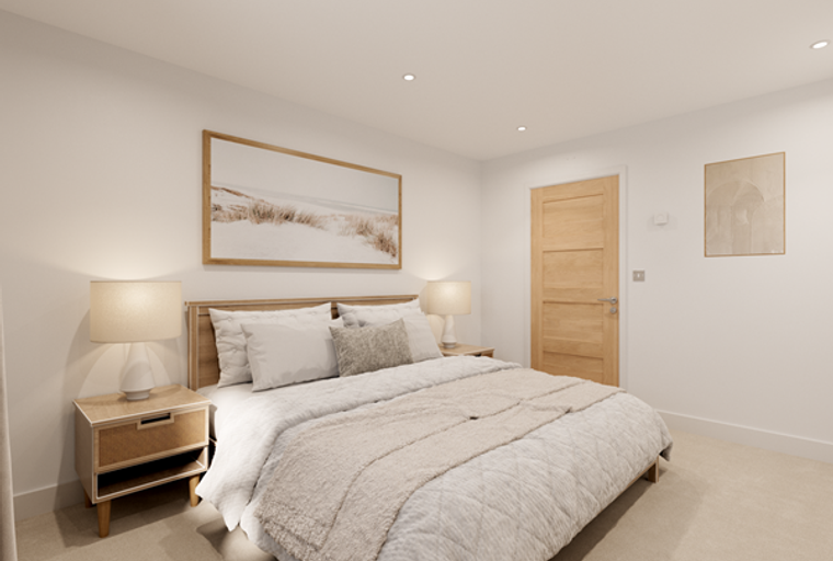 A bedroom with a bed, bedside tables, lamps, and artwork.